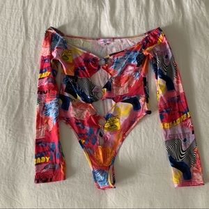 Super fun Dolls Kill bodysuit. Never worn before, selling because it’s too big.